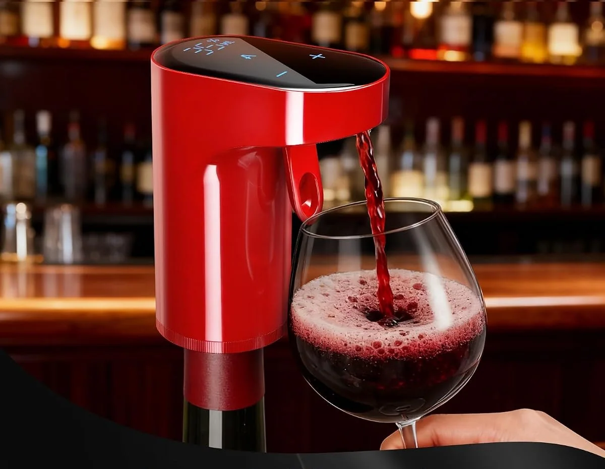 A red Redsack dispenser pours wine at a bar