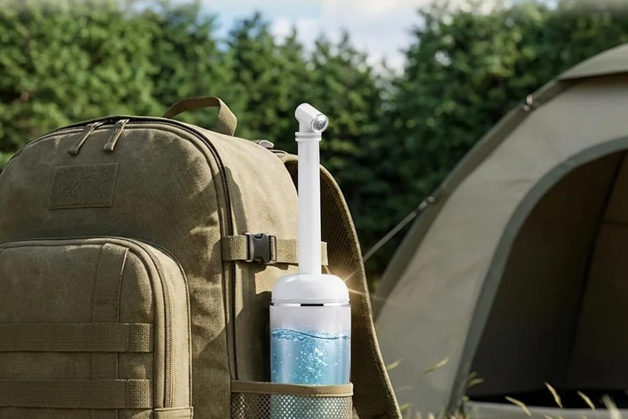 A Redsack squeeze bidet in the side pocket of a backpack at a campsite